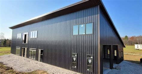 black metal building house|gray barndominium with black trim.